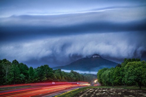 Long exposure of a shelf cloud overtaking Pilot Mountain, in NC. This severe warned storm packed a punch with fast wind, lightning, and hail. Single 4 second exposure @ F/9. From early May 2016.